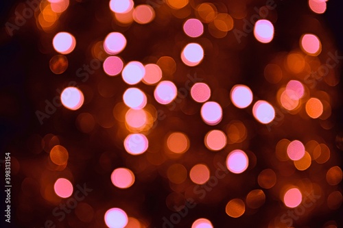 Red lights blurred bokeh abstract on dark background, rozmyte światełka na ciemnym tle lampki świąteczne