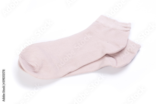 Pair of pink short socks on white background, top view