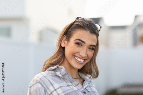 Smiling happy young woman in backyard 0310 photo