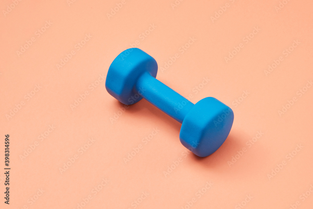 One blue sport dumbbell. One blue sport dumbbell.