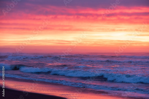 Marine landscape on the background colorful cloudy sky on Khalaktyrsky Beach, Kamchatka.
