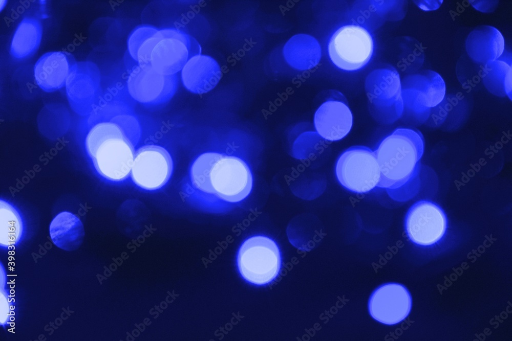 Lights blurred bokeh abstract on dark background, rozmyte światełka na ciemnym tle lampki świąteczne Lights blurred bokeh abstract on dark background, rozmyte światełka na ciemnym tle lampki świąteczne