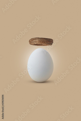Natural egg with halo from wreath.