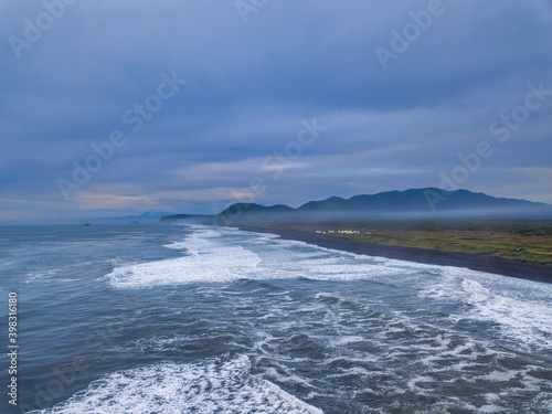 Amazing ocean coastline with mountains line, Kamchatka krai. photo