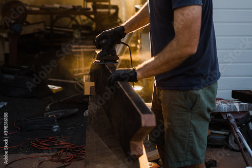 A man sanding stringers photo