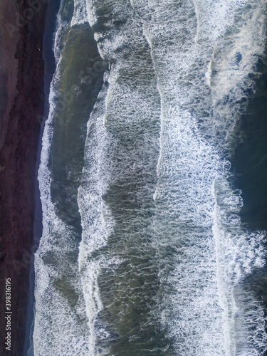 Areal top view from drone above ocean volcanic beach Kamchatka krai, Russia. photo