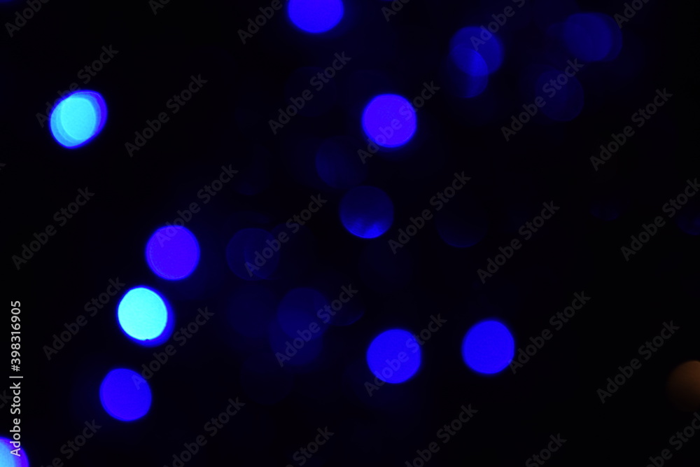 Lights blurred bokeh abstract on dark background, rozmyte światełka na ciemnym tle lampki świąteczne Lights blurred bokeh abstract on dark background, rozmyte światełka na ciemnym tle lampki świąteczne