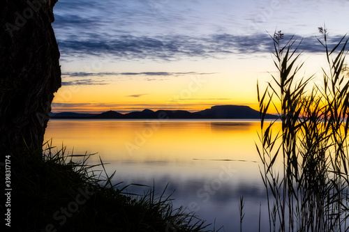 Colorful sunrise clouds over the Lake Balaton of Hungary.