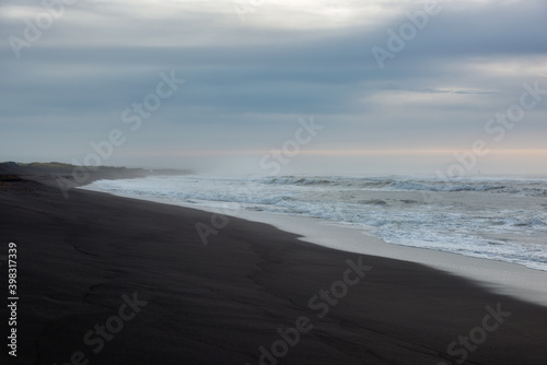 Beautiful coastline of Beach Khalaktyrsky with black volcanic sand, Kamchatka. photo