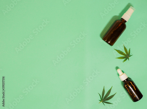 Brown bottles dropper flat lay banner. Cannabis leaf. Marijuana cosmetic. Alternative medicine. CBD oil. Copy space