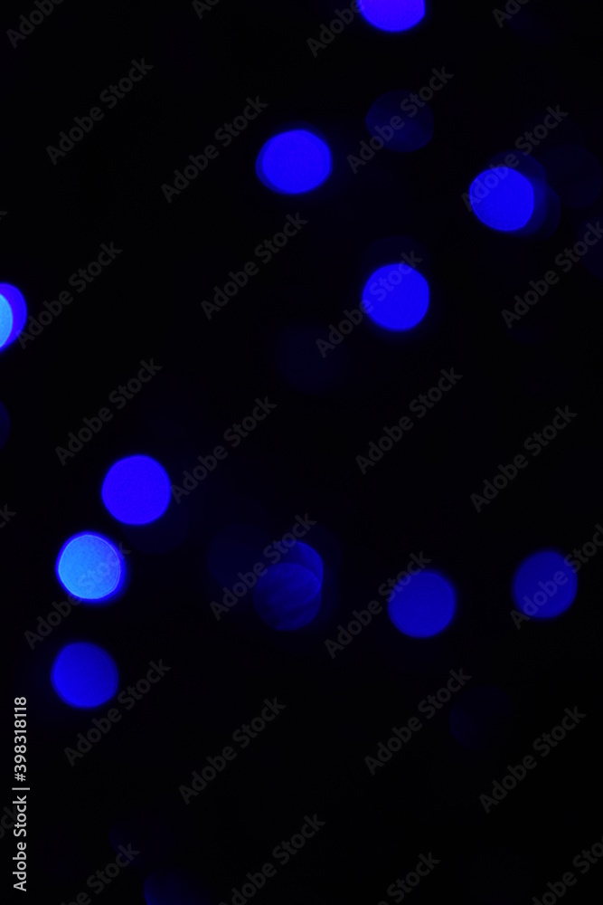 Lights blurred bokeh abstract on dark background, rozmyte światełka na ciemnym tle lampki świąteczne Lights blurred bokeh abstract on dark background, rozmyte światełka na ciemnym tle lampki świąteczne