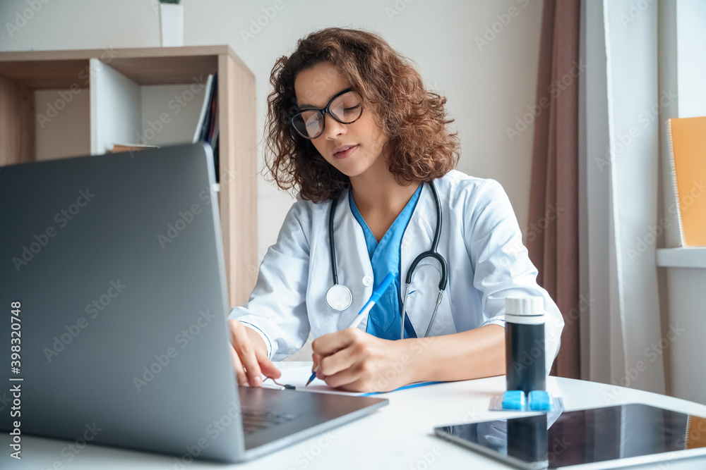 Female doctor wear white medical suit make online video call consult patient. Female doctor wear white medical suit make online video call consult patient.