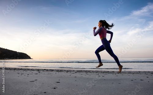 Healthy and port lifestyle of woman running along the beach, runner Woman Running on The Beach