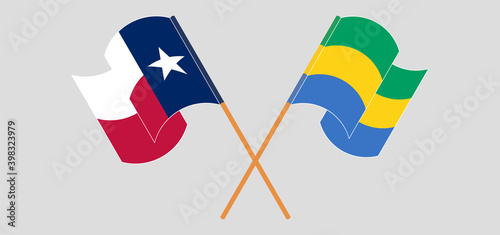 Crossed and waving flags of the State of Texas and Gabon
