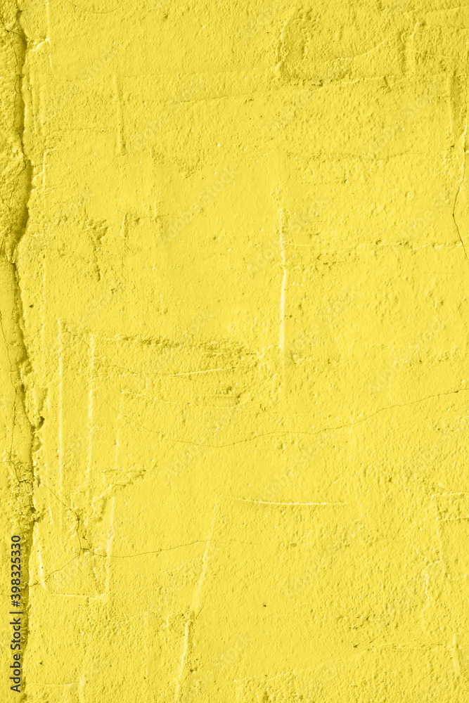 Concrete yellow colorful wall surface texture. Abstract grunge bright illuminating color background with aging effect. Copyspace. Concrete yellow colorful wall surface texture. Abstract grunge bright illuminating color background with aging effect. Copyspace.