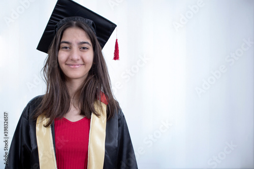 female graduate with diploma