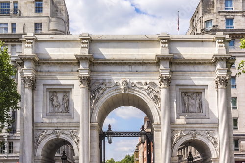View of Marble Arch - white marble faced triumphal arch and London landmark (1827). West End, London, England. photo