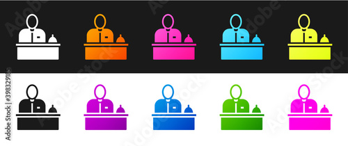 Set Receptionist standing at hotel reception desk icon isolated on black and white background. Vector.