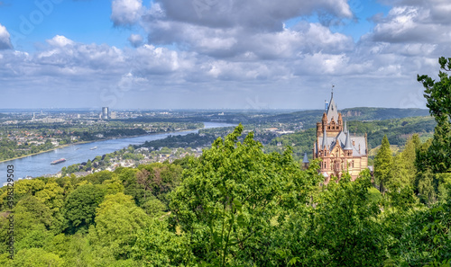 Panoramic view over the castle Drachenburg on the hill Drachenfels in Siebengebirge  the town K  nigswinter and Bonn  the river Rhine valley and the Cologne Lowland  NRW  Germany 