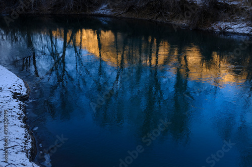 Early Winter Late Autumn Golden Mountain Reflected in River Water Snowy Ground Blue Sky Beautiful Light