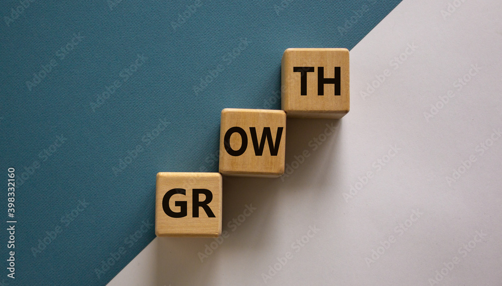 Business growth success process symbol. Wood block stacking as step stair on paper blue and white background with word 'growth', copy space. Business and growth concept. Business growth success process symbol. Wood block stacking as step stair on paper blue and white background with word 'growth', copy space. Business and growth concept.