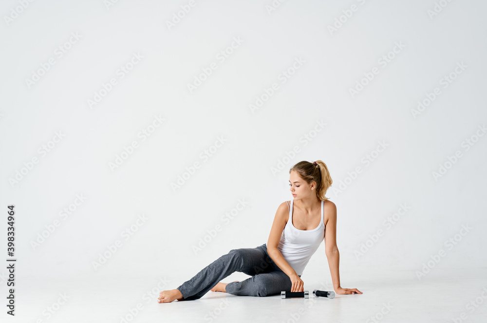 woman in sportswear with dumbbells on the floor muscle bodybuilding fitness woman in sportswear with dumbbells on the floor muscle bodybuilding fitness