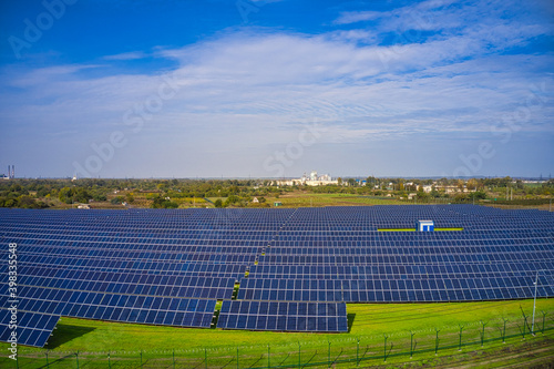 Large solar power plant on a picturesque green field in Ukraine