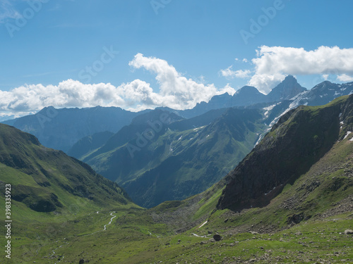 Beutiful green summer alpine mountain valley with winding river spring stream. Stubai hiking trail, Stubai Hohenweg at Tyrol, Austrian Alps