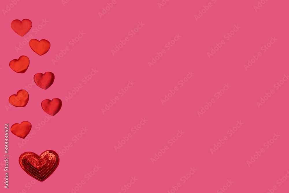 Red bright background of little hearts on a pink background