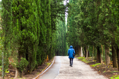 Woman in the botanic garden and park, trees and casual young girl portrait in garden