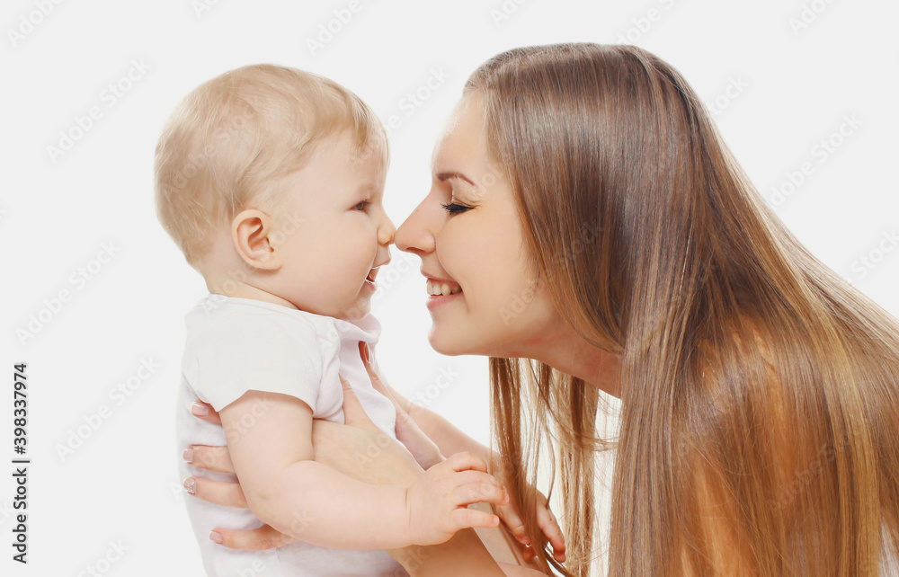 Portrait of cheerful smiling mother and baby playing together over a white background Portrait of cheerful smiling mother and baby playing together over a white background