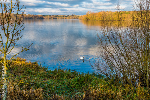 A view across the still waters of the northern section of Pitsford Reservoir, UK in winter photo