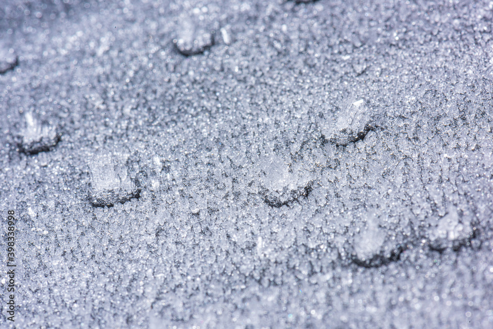 Obraz premium Ice crystals forming on sand grain..