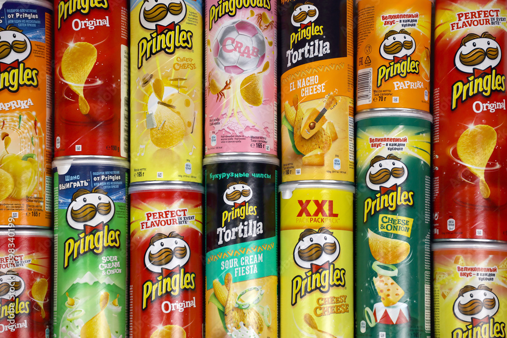 Pringles variety of flavors. Many cardboard tube cans with Pringles