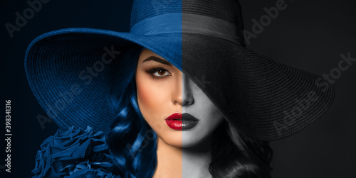 Portrait of a beautiful woman with red lips in a hat, toned in color of the year 2020 and 2021, classic blue, ultimate grey