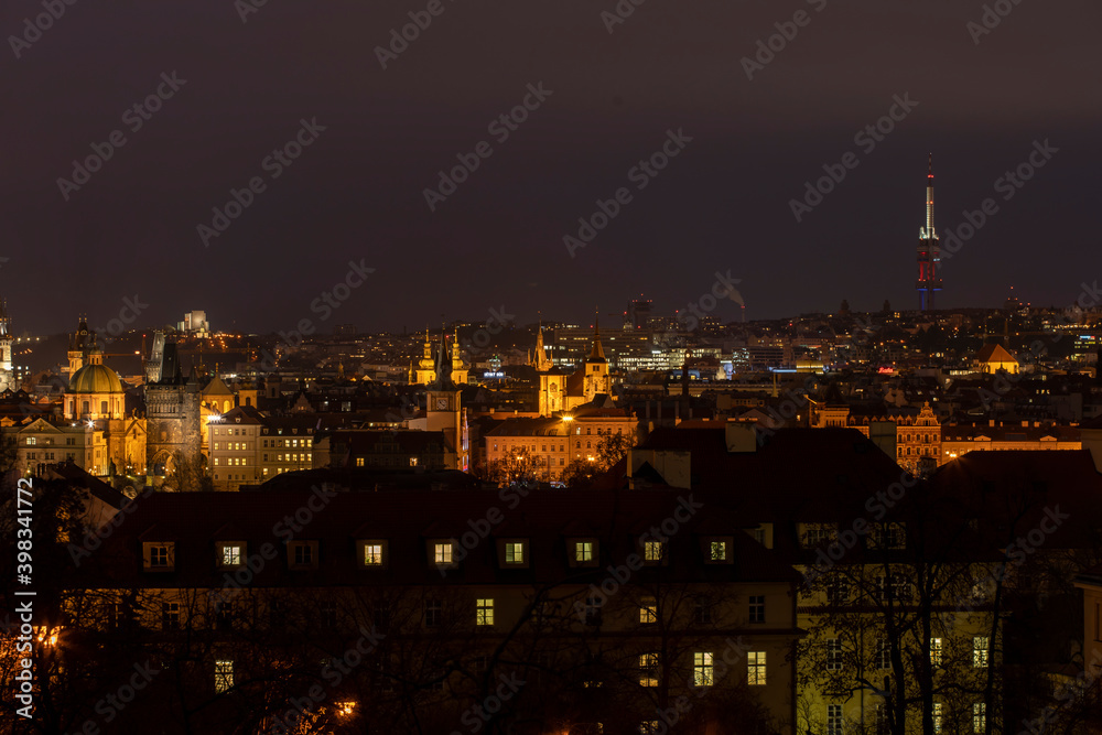 .light from street lights and a view of the city of Prague