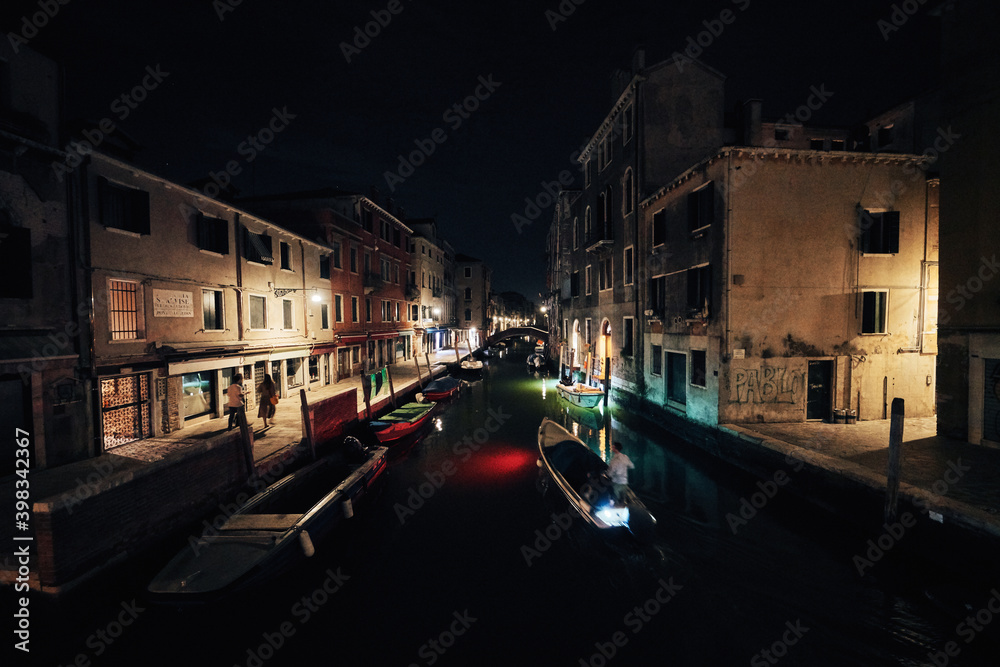 bridge and water view over a canal in Venice at calm night