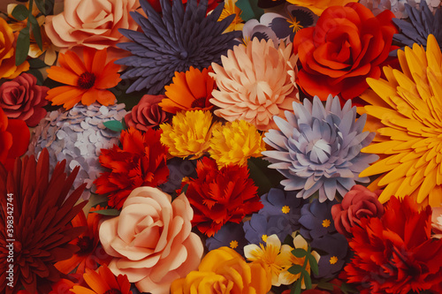 Colorful paper flowers background. Red, orange, peach, purple, violet, blue roses, asters, hydrangea, carnations, peonies made of paper. Handmade craft creative abstraction backdrop. Selective focus.