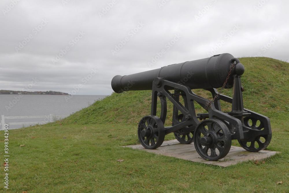 A cannon stands guard over Charlottetown Harbour from Prince Edward Battery in PEI.