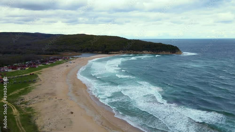 High and powerful waves coming fast to the beach, waves in winter day High and powerful waves coming fast to the beach, waves in winter day