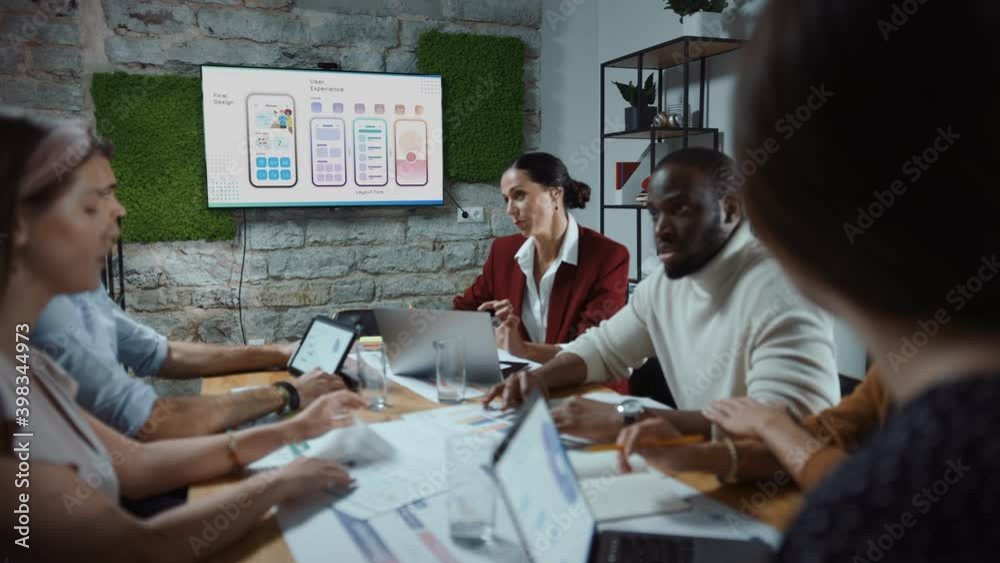 Diverse Multi-Ethnic Team of Start-up Entrepreneurs, Software Engineers, App Designers Have Meeting in the Modern Office Conference Room. Creative Team Discuss, Plan Social Media Strategy