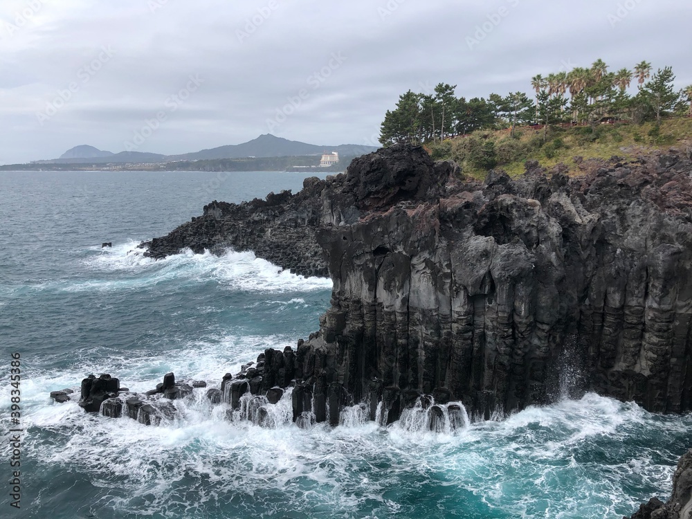 waves crashing on a rock