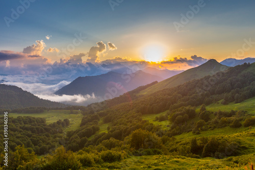 Beautiful mountain landscape at Caucasus mountains with clouds and blue sky