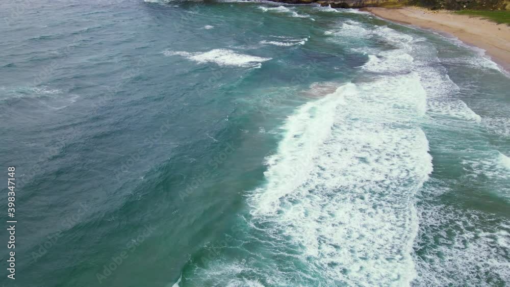 High and powerful waves coming fast to the beach, waves in winter day High and powerful waves coming fast to the beach, waves in winter day