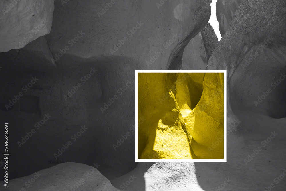 Fototapeta premium Color of the year 2021 is illuminating yellow and the ultimate gray. Natural light rocks with sunrays and shadows. Trendy authentic background