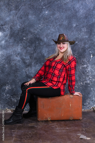 Attractive plump woman dressed in cow boy style photo