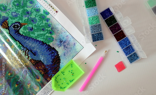 Diamond mosaic fragment picture close-up top view, handmade, hobby.