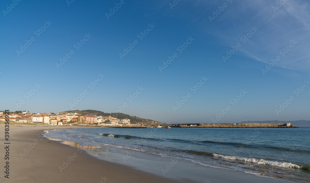 the beach and harbor in the fishing village of Laxe in western Galicia