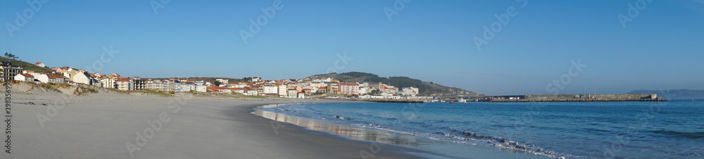 panorama banner view of the beach and Galician town of Laxe in northern Spain