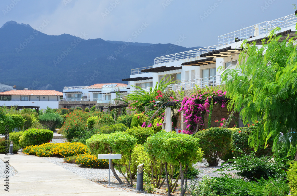 Typical architecture in Cyprus. Modern luxury cottages, apartments. beautiful city landscape in background of mountains.